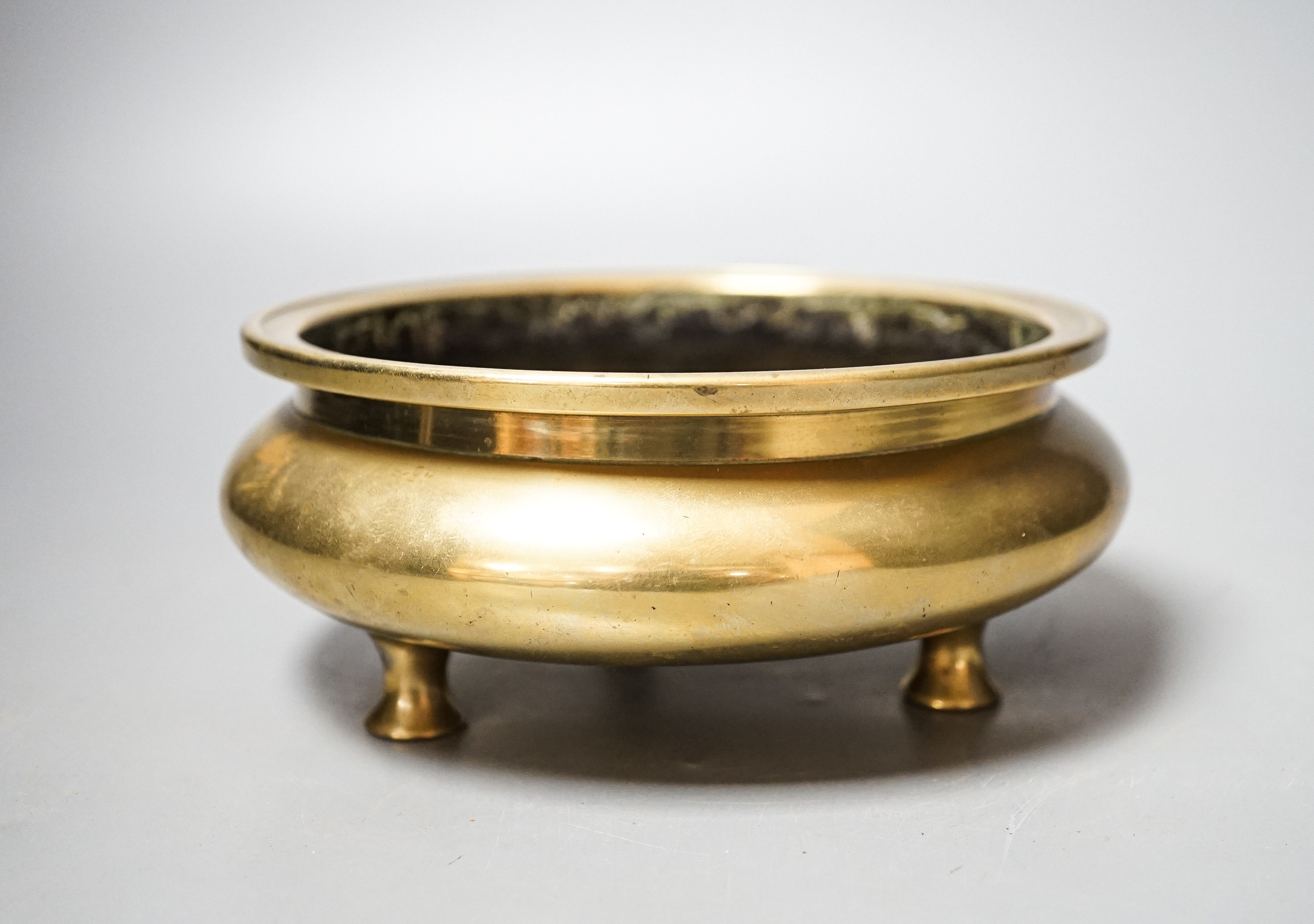 A Chinese bronze censer, ding, Xuande mark, 18th / 19th century, diameter 16.6cm, height 6.7cm